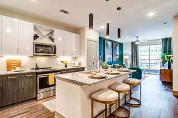 Skye suwanee town center apartments in suwanee, georgia model kitchen with island